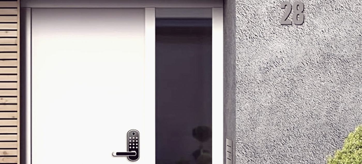 A TTLock-platform lock beside the app screen used to control it.